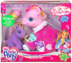 Size: 475x415 | Tagged: safe, photographer:absol, baby, baby bottle, baby pony, bonus, bottle, box, box cover, brush, clothes, cute, earth pony, electronic toy, eyes open, female, filly, foal, g3, g3 logo, g4, good morning sunshine, good morning sunshinedorable, hasbro, hasbro logo, human, imported from derpibooru, irl, irl human, logo, mare, my little pony logo, pacifier, pajamas, photo, plushie, pony, simple background, sitting, so soft, sweetsawwwng, sweetsong, toy, try me, white background