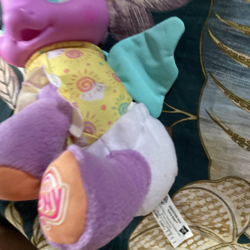 Size: 1600x1600 | Tagged: safe, baby, baby daze (so soft newborn), baby pony, bedroom, blue wings, clothes, cute, derpibooru, diadazes, diaper, diaper daze (so soft newborn), doll, female, filly, foal, g4, g4 logo, hasbro, hasbro logo, imported from derpibooru, indoors, irl, logo, meta, my little pony logo, newborn, pegasus, photo, pony, shirt, so soft, so soft newborn sunny daze, sunny daze (so soft newborn), tags, toy, wings