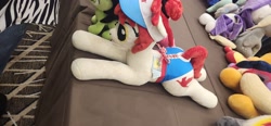 Size: 4000x1848 | Tagged: safe, rarity, twilight sparkle, oc, oc:filly anon, oc:wah wah, cloudchaser, derpy hooves, female, filly, foal, g4, horn, imported from derpibooru, indoors, irl, lying down, mare, mare fair, pegasus, photo, plushie, pony, prone, sunset shimmer, unicorn