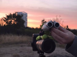 Size: 4096x3072 | Tagged: safe, oc, oc:filly anon, binoculars, camera, female, filly, foal, grass, imported from derpibooru, irl, lying down, oc only, outdoors, photo, plushie, prone, solo