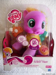 Size: 450x600 | Tagged: safe, baby, baby pony, box, cute, daaaaaaaaaaaw, diadazes, diaper, electronic toy, female, filly, foal, g4, g4 logo, hasbro, hasbro logo, hnnng, hub logo, implied wings, imported from derpibooru, indoors, irl, logo, merchandise, my little pony logo, official, pacifier, pegasus, photo, pony, so soft, so soft newborn sunny daze, speech bubble, sunny daze (so soft newborn), the hub, toy, try me, wings
