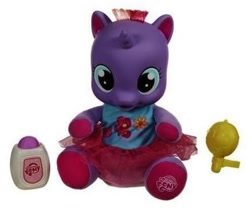 Size: 378x314 | Tagged: safe, photographer:absol, baby, baby lily (g4), baby pony, baby powder, clothes, cute, dialilys, diaper, dress, electronic toy, female, filly, foal, g4, g4 logo, horn, imported from derpibooru, irl, lily (g4), logo, my little pony logo, photo, pony, rattle, shirt, simple background, sitting, skirt, so soft, so soft tickle 'n gigglin' lily, toy, tutu, unicorn, white background, younger