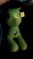 Size: 540x960 | Tagged: safe, oc, oc:filly anon, animated, boop, color change, female, filly, foal, green oc, imported from derpibooru, irl, light up, oc only, photo, plushie, video