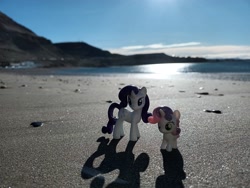 Size: 4000x3000 | Tagged: safe, artist:dingopatagonico, rarity, sweetie belle, beach, duo, duo female, female, filly, foal, g4, horn, imported from derpibooru, irl, mare, outdoors, photo, pony, sand, siblings, sisters, sun, toy, unicorn, water