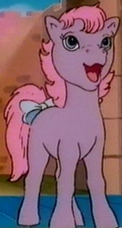 Size: 264x492 | Tagged: safe, adorember, bow, cropped, cute, earth pony, ember (g1), female, filly, foal, g1, imported from derpibooru, open mouth, open smile, pony, rescue at midnight castle, screencap, smiling, solo, tail, tail bow